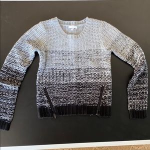 gray/black sweater with decorative zippers